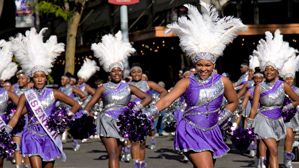 Photo of class of 2025 seniors, dancers wearing purple and silver sequins outfits