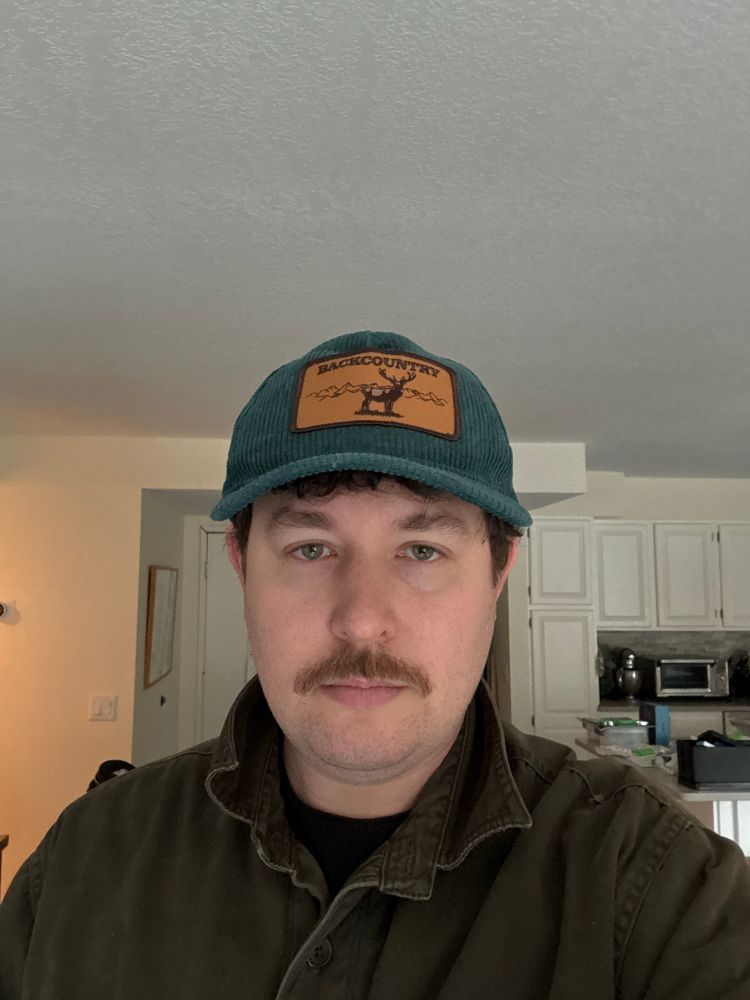 Me with a bad mustache and very north woods Wisconsin coded attire,