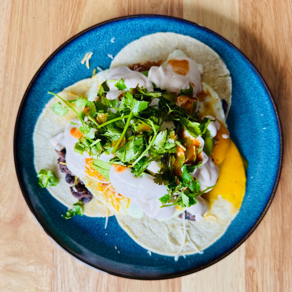 A blue plate with Huevos Rancheros.