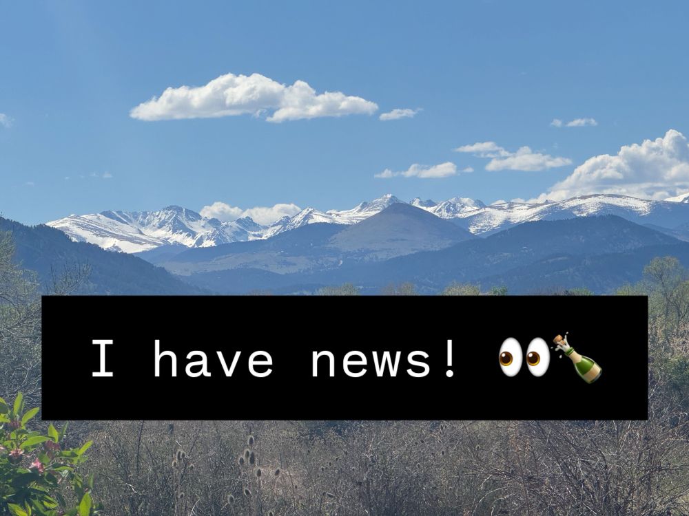 An image of mountains with the words “i have news”