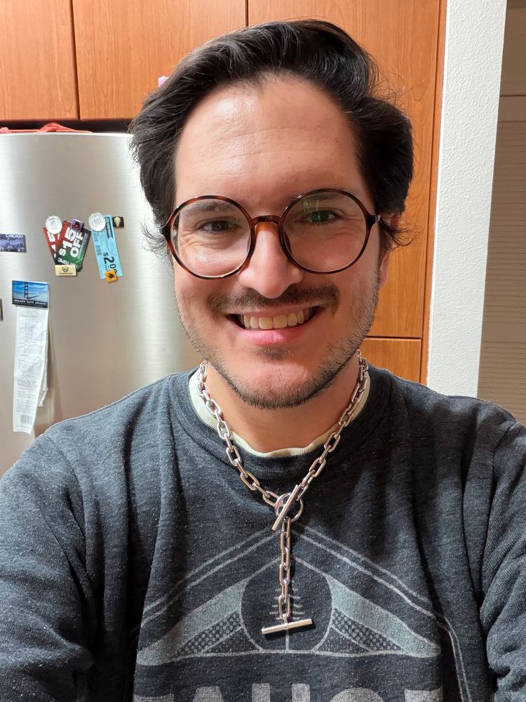 Selfie of me wearing my new necklace, the Deadbolt from Vitaly. 