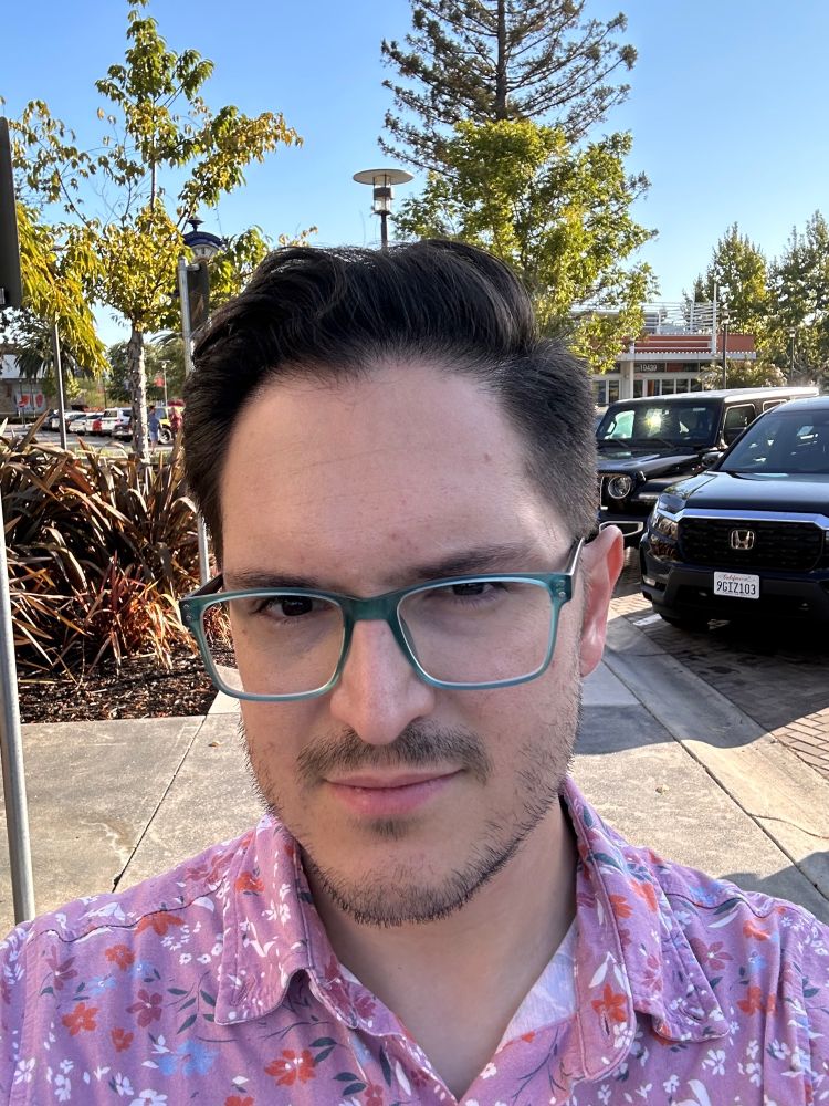 Photo of me standing outside with a fresh haircut