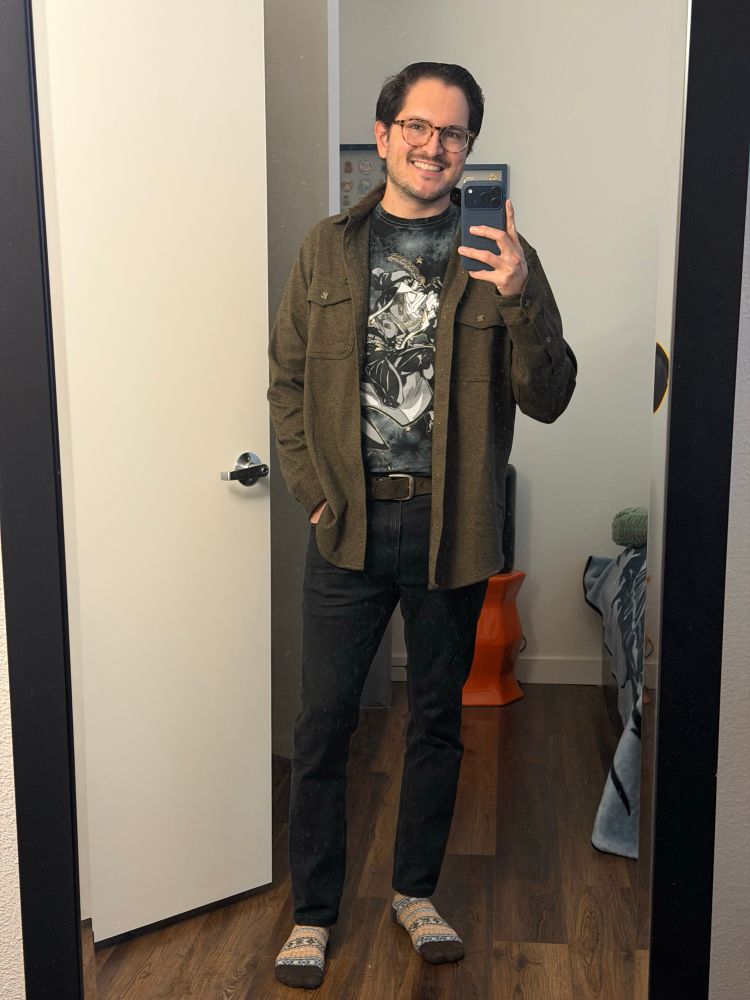 Black jeans, flannel, and jotaro kujo with glittery outlines 
