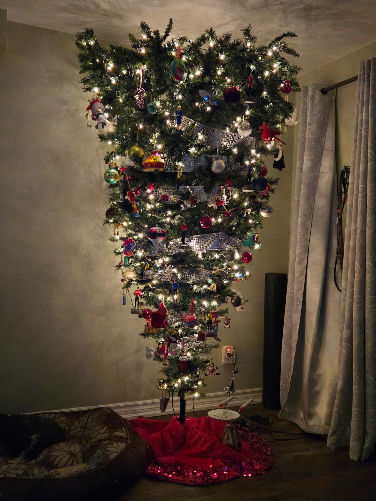Upside down Christmas tree with lights and decorations.