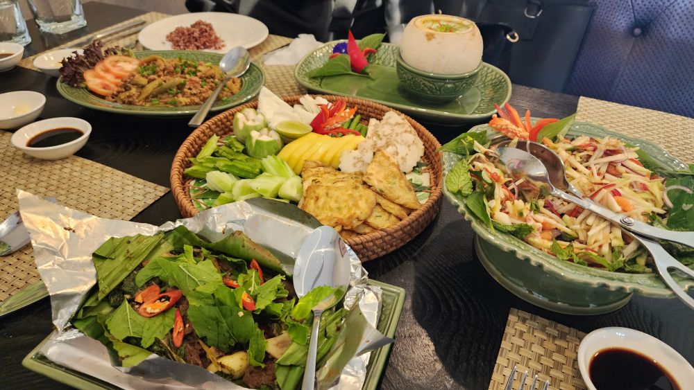 I regularly enjoy Khmer food for lunch and dinner. Cambodian cuisine is one of Asia's hidden treasures, though it remains largely unknown outside Cambodia except in Cambodian-owned restaurants worldwide. If you're visiting Cambodia, be sure to try Khmer food, whether from street vendors or restaurants.
In the picture: Pan-Fried Eggs with Promar Fish, Stir-Fried Red Ants with Beef, Fish Amok, Green Mango and Smoked Fish Salad with Sun-Dried Shrimp, and Eggplant with Minced Pork.