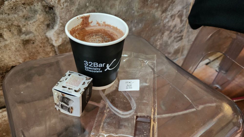 Located in Bangkok's historic Talad Noi neighborhood, 32Bar X  is a hidden gem that perfectly embodies the area's blend of old-world charm and contemporary culture. This specialty chocolate   based cafe is housed in a rundown corner of shophouses in the area, featuring an exposed brick walls and eclectic decorative elements. 
At 32bar X you can choose either of one the 12 chocolate based drink. Price starting 140 THB  - 200 THB for a cup or you can choose set which include a chocolate drink of your choice hot or cold and 4 pieces of chocolate of your choice price starts from 280 THB - 500 THB.
How to get there: Take the MRT to Hua Lamphong station, then walk about 10-15 minutes through the characterful streets of Talad Noi. The bar is open everyday from 10:40am AM to 7:00 PM. It's an ideal spot to rest and refuel while exploring the neighborhood's famous street art, ancient Chinese shrines, and antique shops