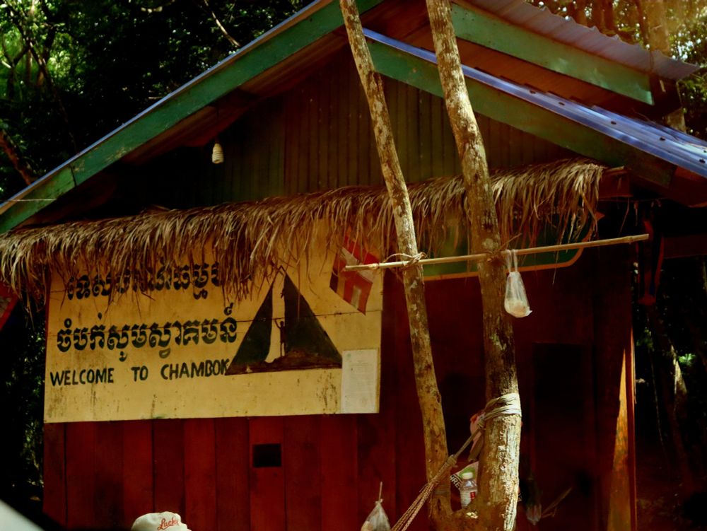 Chambok Waterfall: A Community Ecotourism Gem

The magnificent Chambok Waterfall is located in the southern part of Kirirom National Park. This impressive 40-meter cascade tumbles into a natural pool surrounded by lush vegetation and pine forests.

What makes Chambok special isn't just its natural beauty—it's also the community-based ecotourism initiative that manages it. Established in 2002, the project brings together nine surrounding villages to preserve their natural resources while creating sustainable livelihoods through tourism.

Reaching the waterfall requires a pleasant 3-kilometer hike through the forest. The well-maintained trail is relatively easy and takes about 40 minutes to complete. During our October visit, the waterfall was particularly impressive, with strong water flow creating misty conditions at its base. Entrance fees are $3.00 for foreigners and 5,000 Riels for locals.