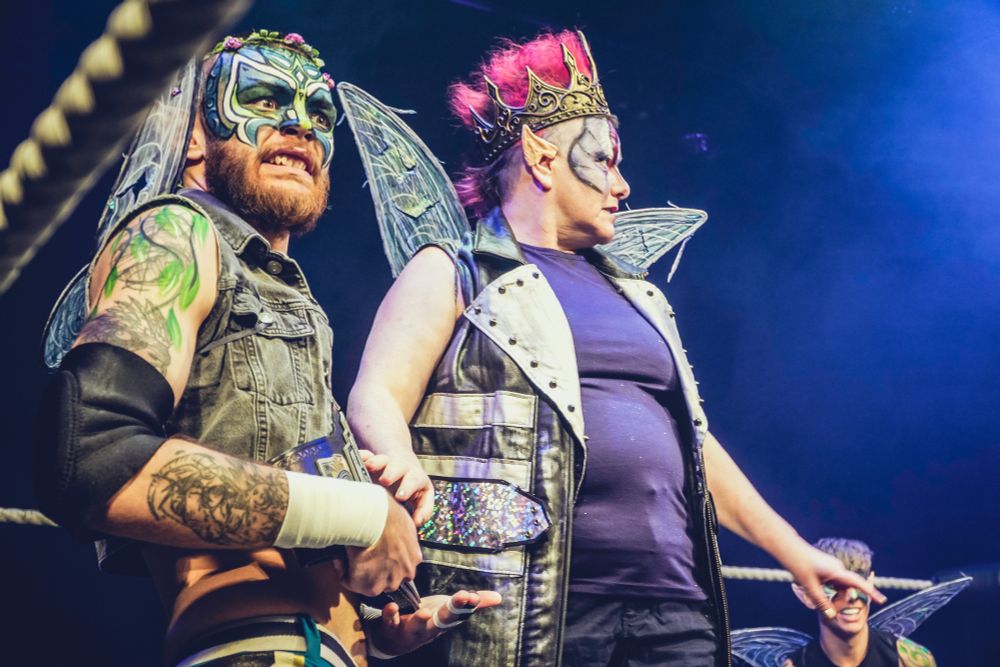 Titania, Queen of the Fairies, holds her fairy henchman back
