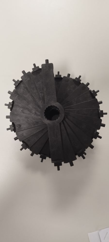 An unnecessary amount of Pipette tools stacked forming a spiral staircase-like structure, seen from above