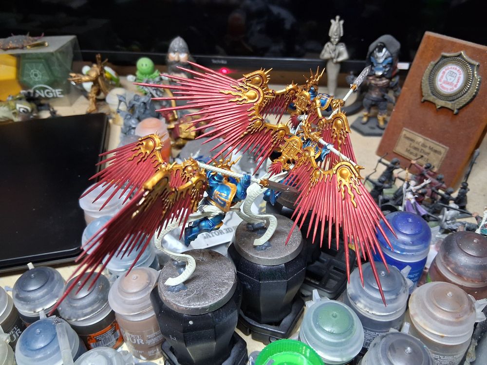 The cobalt armoured prosecutors with gold trim and metallic red wings now have all their weapon wraps and parchment based in, the crackle paint overlaid with a silver, and the rocks painted grey.