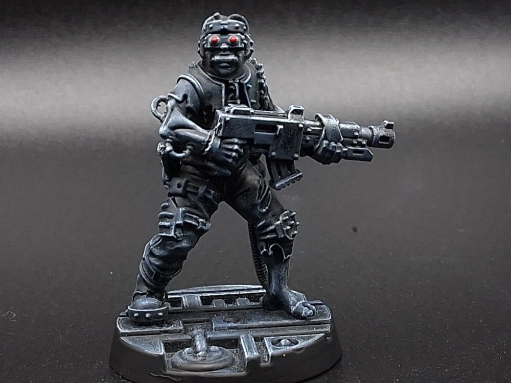 Psychoteric thrall for necromunda in midnight greyscale with red eye lenses.

Some poor bastard grabbed off the street, with a lasgun, and one boot missing