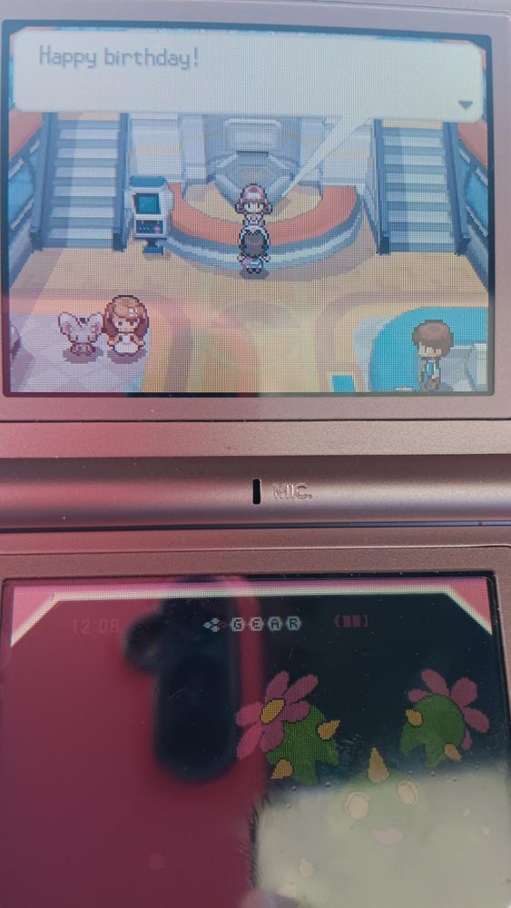 A picture of me playing Pokemon Black on the Nintendo DS. The player is in a Pokemon Center, and the attendant at the pokemon center is telling the player "Happy birthday!"