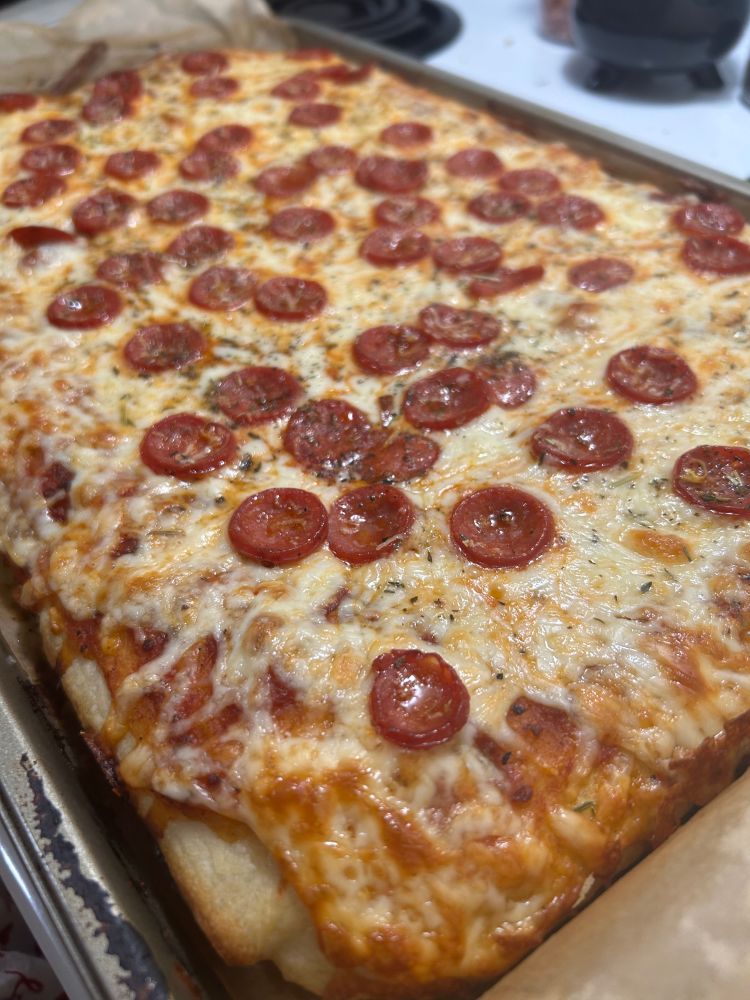 a focaccia pizza with pepperoni and cheese