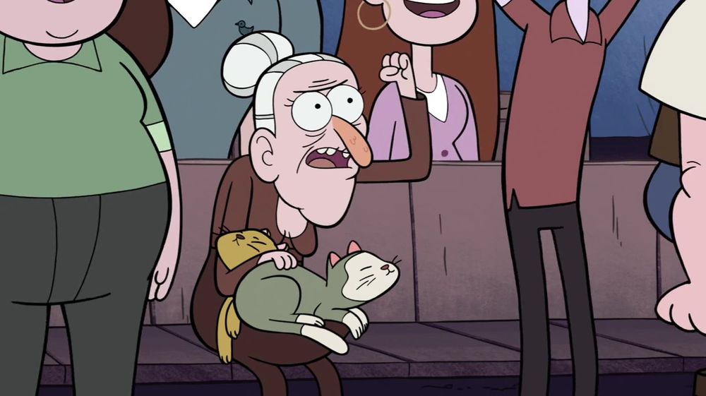 An old lady petting her cat in a theater seat