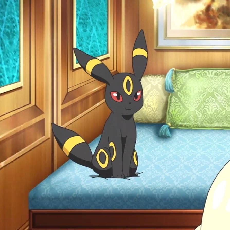 Umbreon sitting on a sofa 