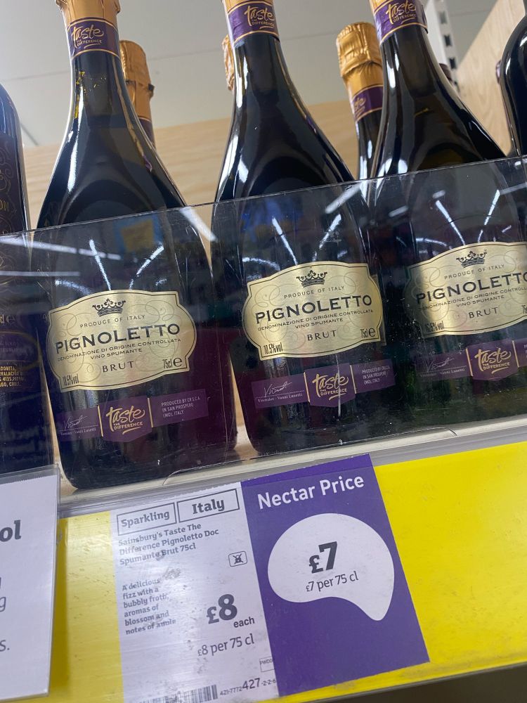 3 bottles of Sainsbury’s taste the difference Pignoletto wine on a shelf normal price £8 - nectar price £7