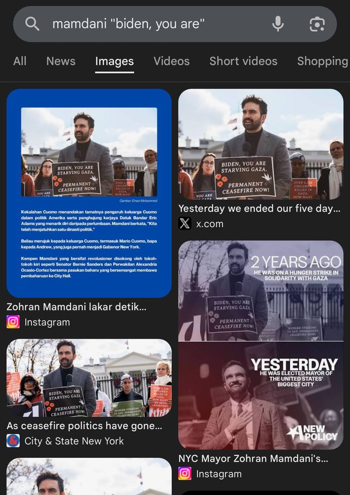 Google results for the text on a sign held by Mamdani in the photo. Instances of the photo predating the "Trump copied his outfit" meme show that the turtleneck was actually grey