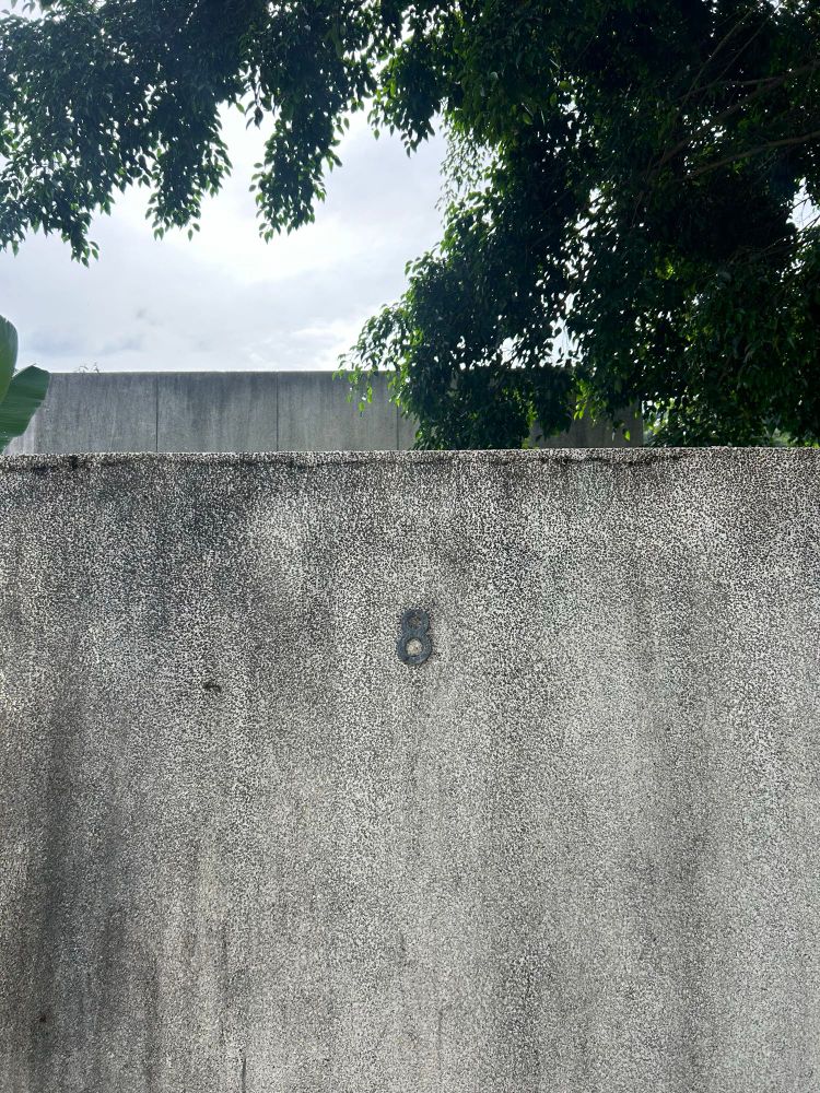 Outer wall of property bearing house number 8