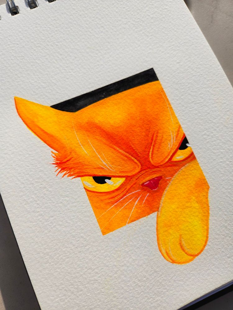 Closeup - An orange cat tries to get through a hole.  But only gets a paw in and an ear through.