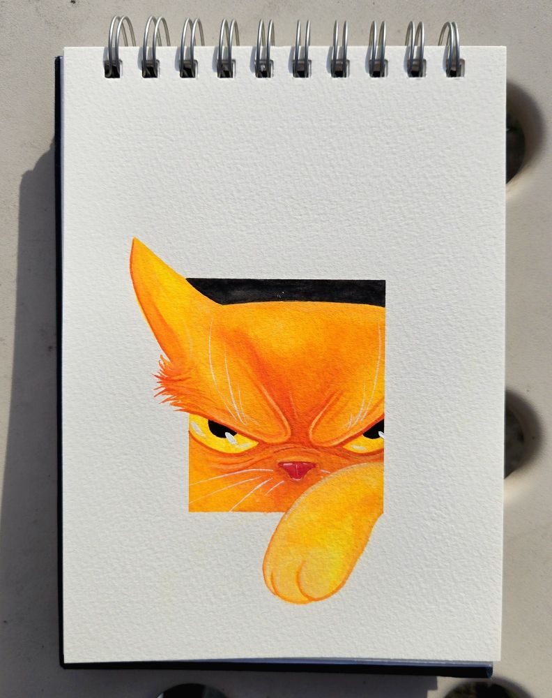 An orange cat tries to get through a hole.  But only gets a paw in and an ear through.