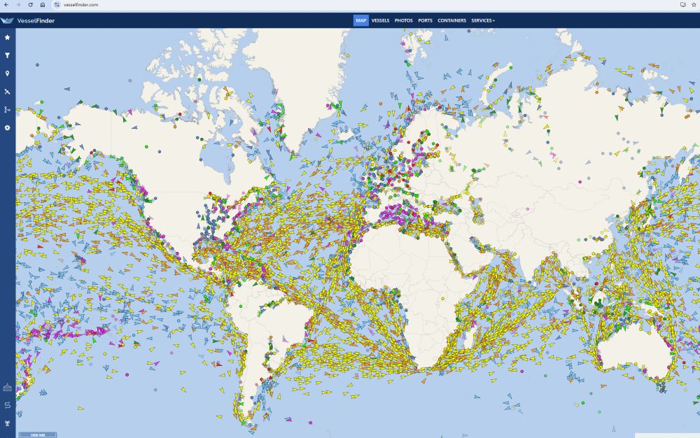 Map of the world with oceans covered in ship icons via VesselFinder.com