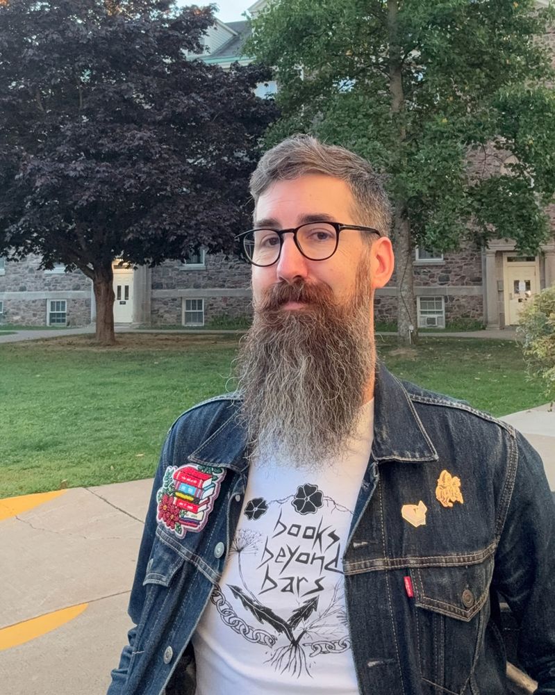 me in a Books Beyond Bars shirt