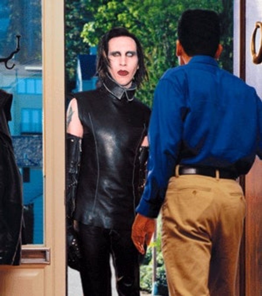 OVERLAND PARK, KS–Stung by flagging album sales and Eminem’s supplanting him as Middle America’s worst nightmare, shock rocker Marilyn Manson has embarked on a door-to-door tour of suburbia in a despe...