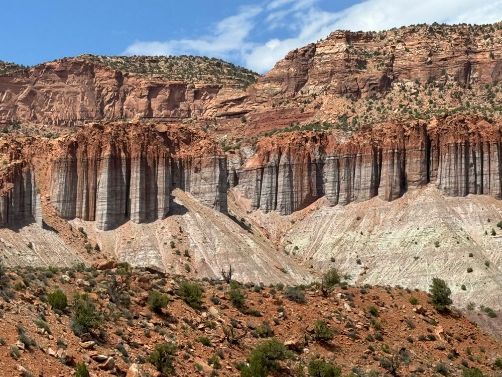 Fluted lavender cliffs topped with red rock