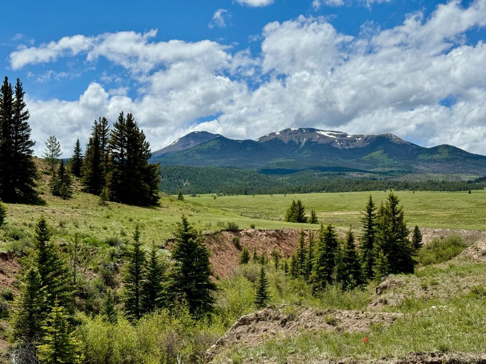 Blue sky, clouds, mountains, meadows, trees