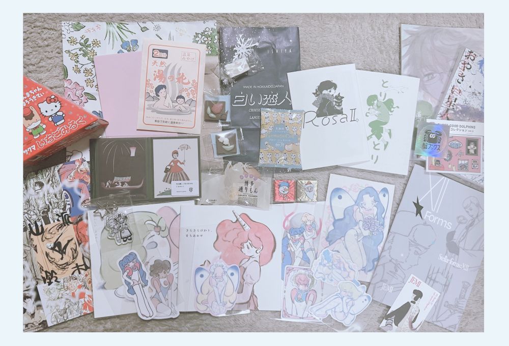 コミティア154での差し入れや購入作品を並べた様子