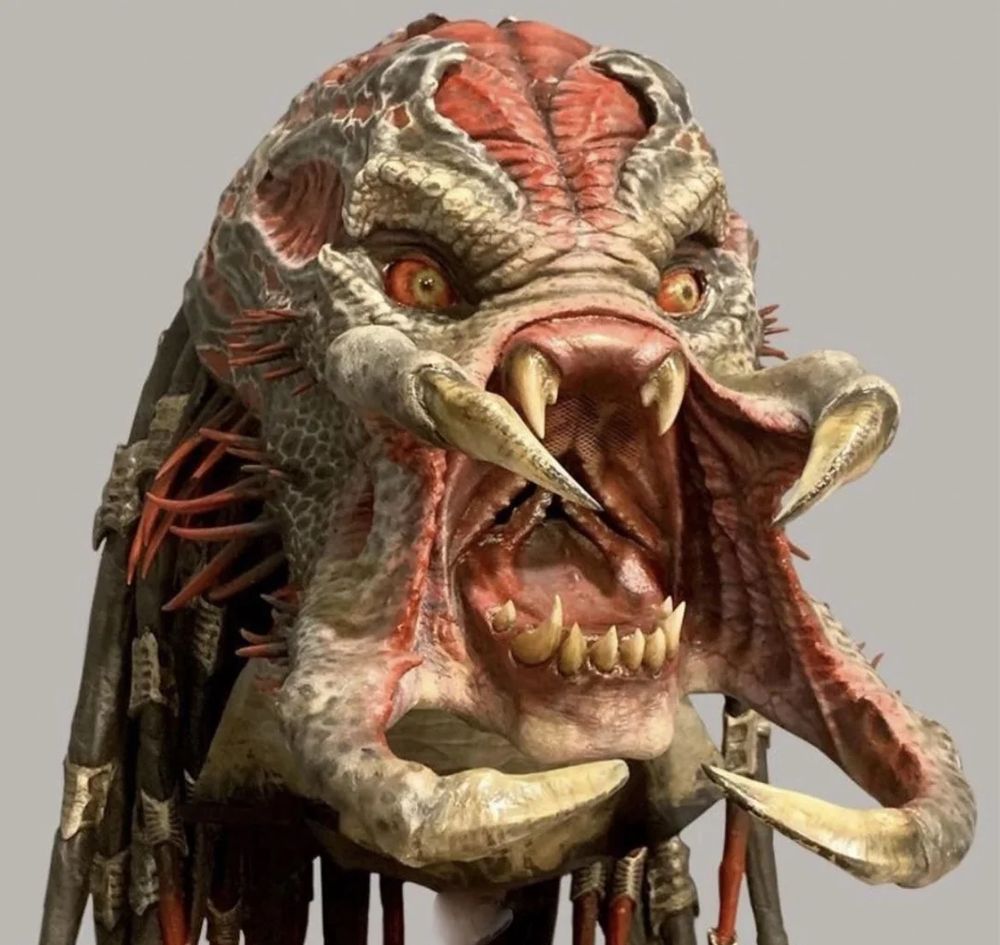 the predator, from the movie predator, with its mandibles wide open