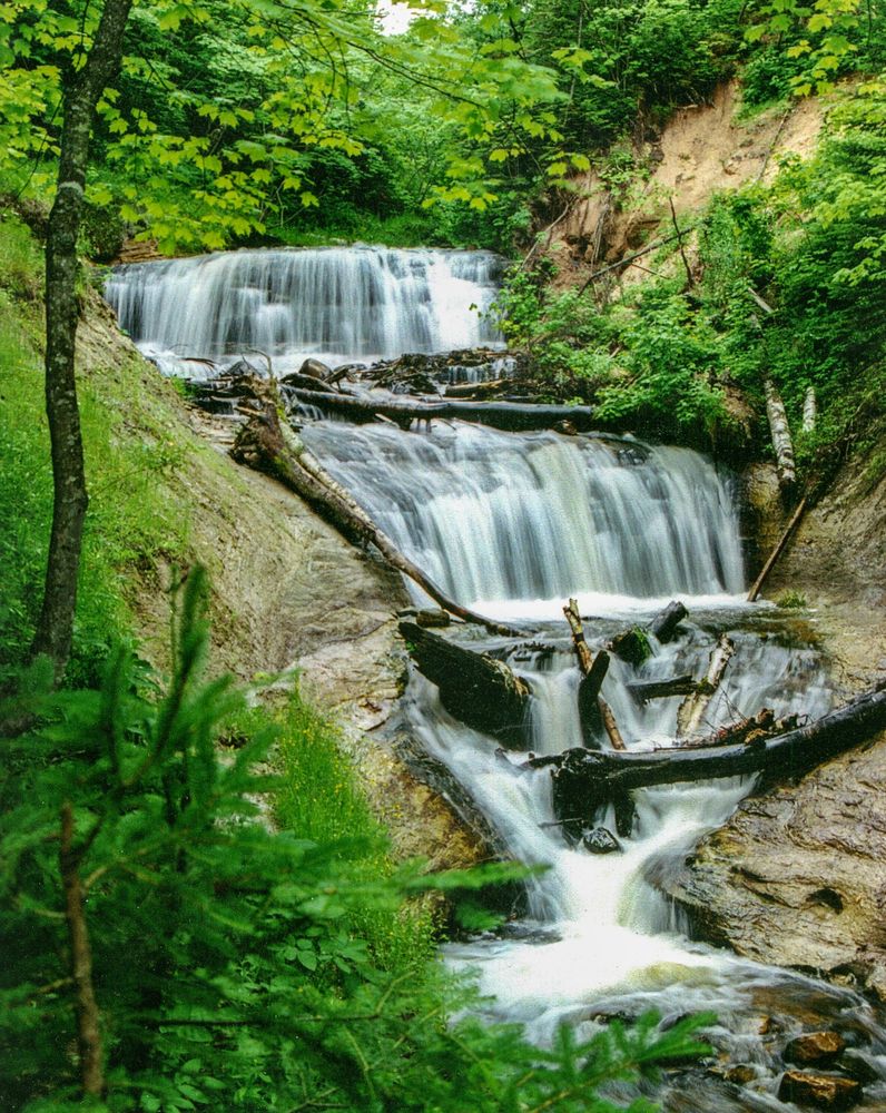 A summer photo of Grand Sable Falls in 
Grand Marais, Michigan.