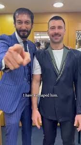 Sam's Tailor with a guy getting a suit done.