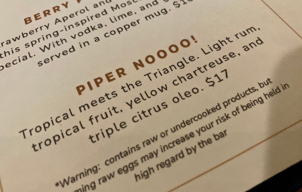 A cocktail menu with a drink called Piper Noooo! It’s a reference to a character on the show The White Lotus