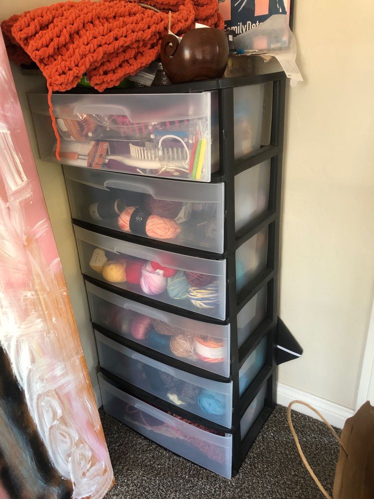 Plastic drawer tower with yarn, tools, WIPs
