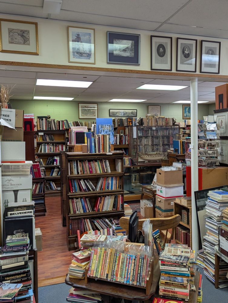 Multiple shelves full of books for sale