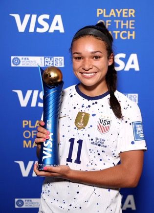a photo of sophia smith of the us women’s national team holding the player of the match trophy after the world cup match of usa vs vietnam 