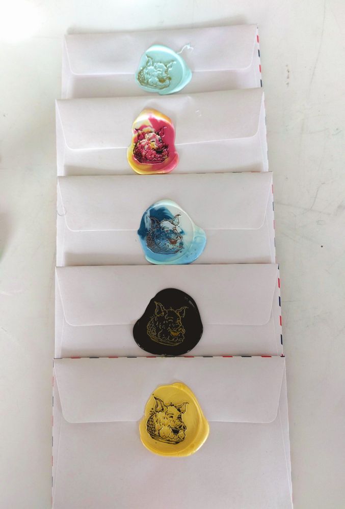 Five letters, each bearing the wax sigil of a pig's head in various colours.