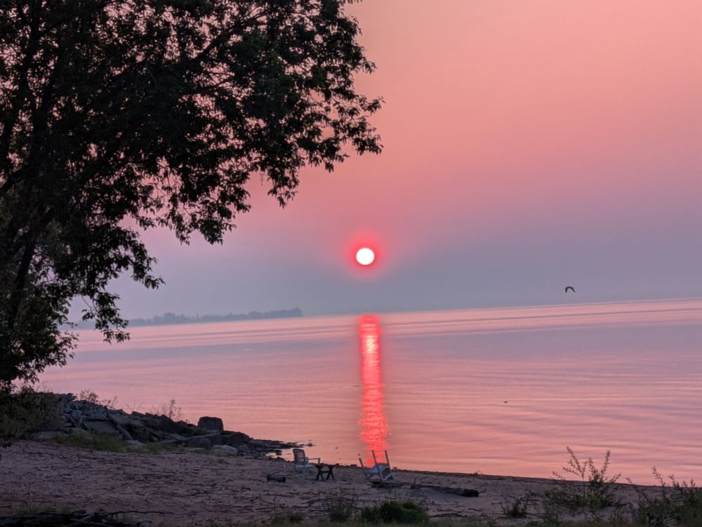 Due to continued Canadian wildfire smoke drifting into the area, the sun has been muted.