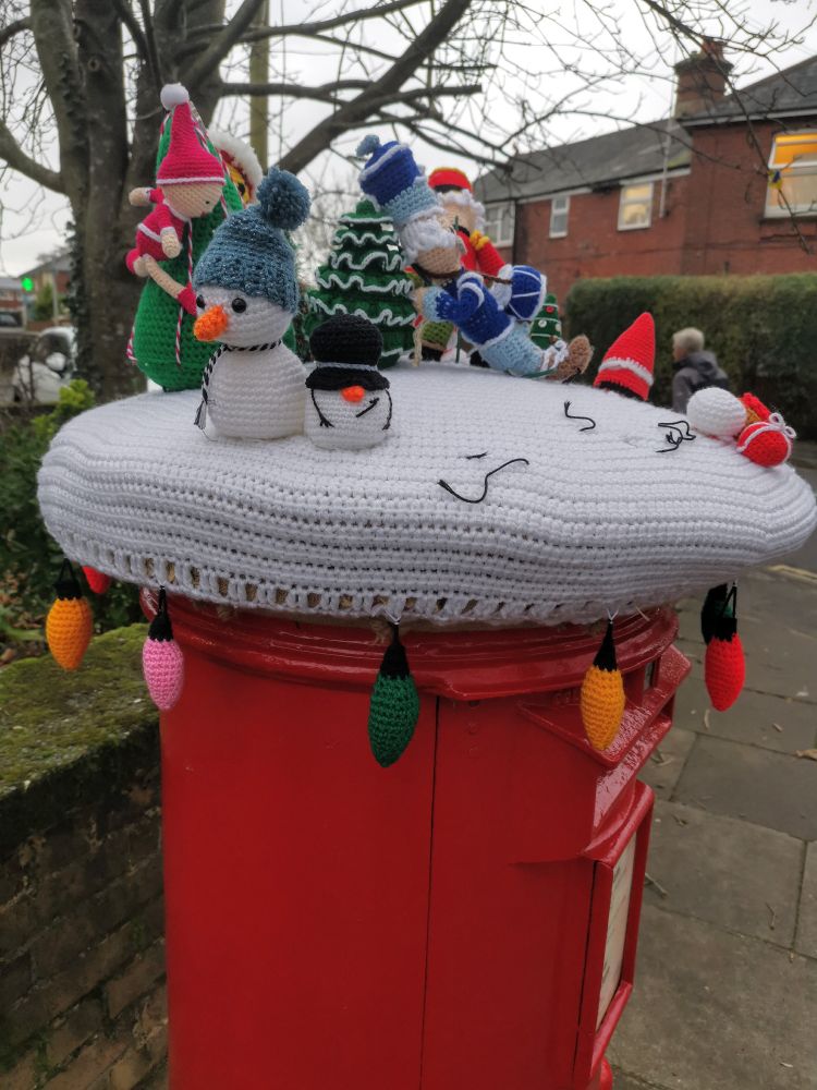 Crochet post box covers outside Bitterne Library, Southampton UK