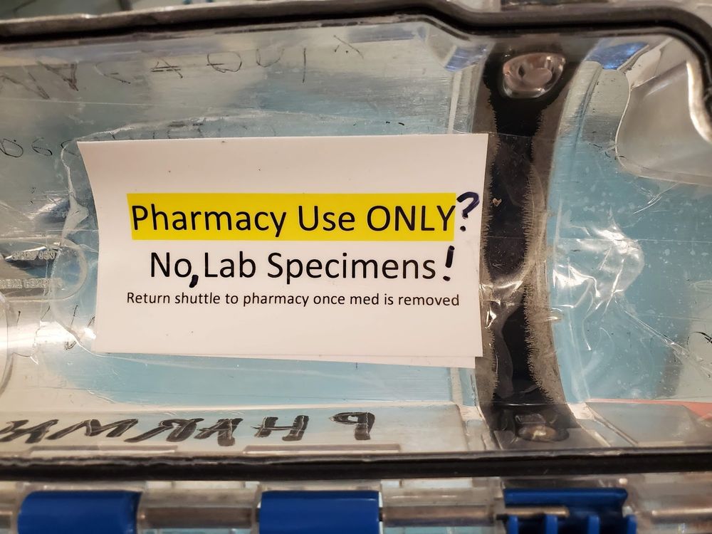 A pneumatic tube carrier with an label that originally read, "Pharmacy Use ONLY/ No Lab Specimens."  Some smartass modified it to read, ""Pharmacy Use ONLY? No, Lab Specimens!"