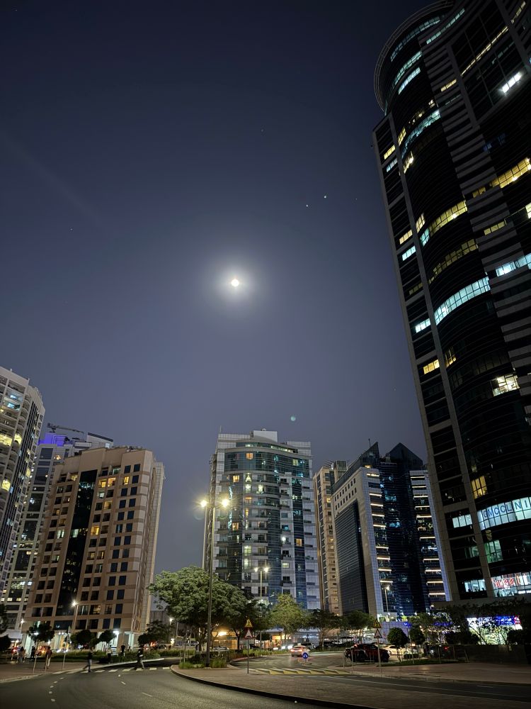 Photo of moon in a city scape
