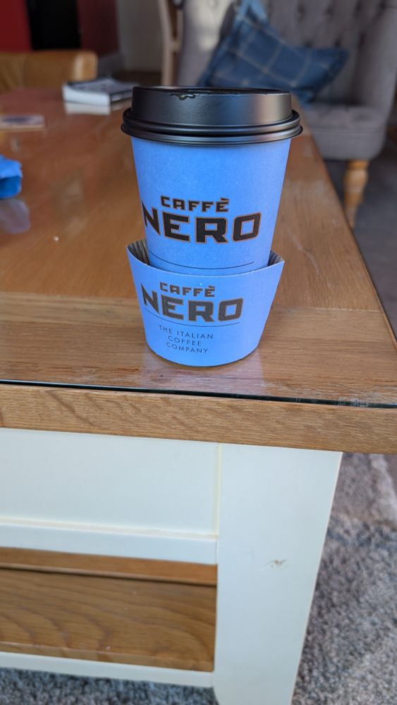 Caffé Nero hot coffee cup. 