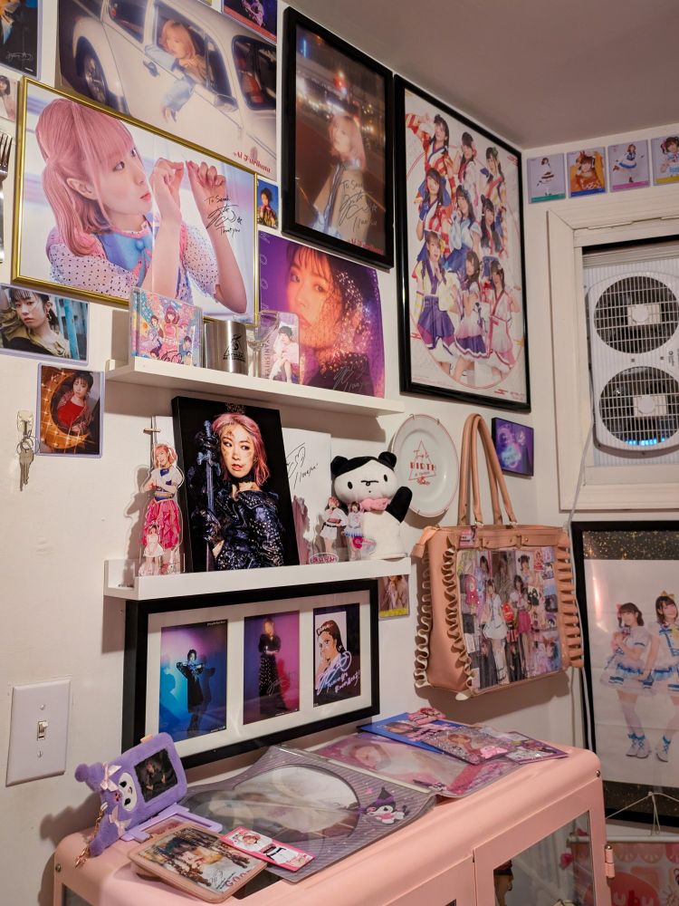 wall shrine with furirin posters & shelves with merch