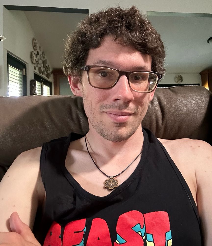 The gay Kat uncle admiring his big shiny curls while enjoying the cozy afternoon  