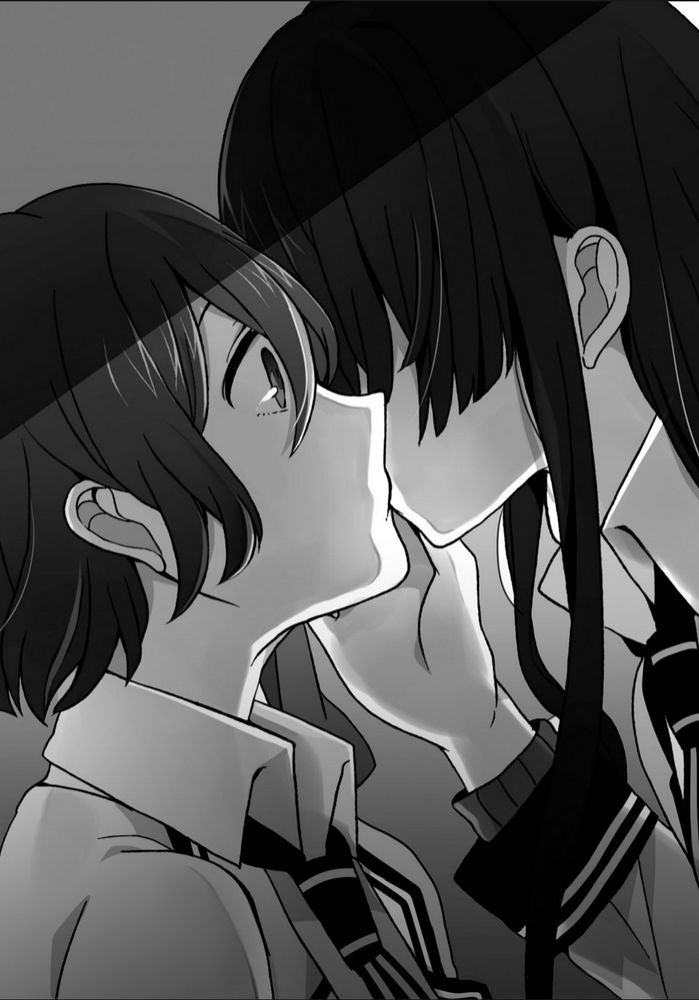 A black and white illustration from the Shuuen no Shiori light novels of two characters, B-Ko and D-Ne, kissing. D-Ne has long, dark hair that obscures her face and is initiating the kiss. Her right hand is cupping B-Ko's cheek. B-Ko has short, also dark but slightly lighter hair, and is receiving the kiss with her eyes open. Both of them are wearing their school's uniform.