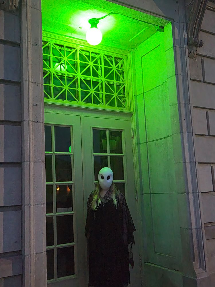 Me standing under a green light