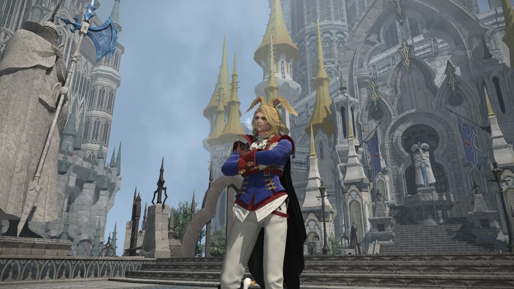 Bunny man dressed in a blue and red bliaud in front of a church 