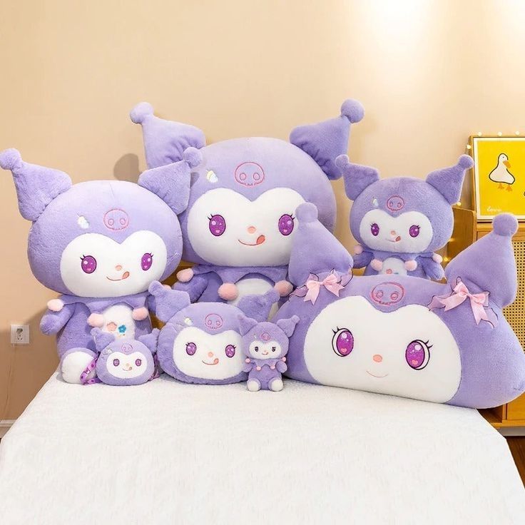 Different sized kuromi plushies