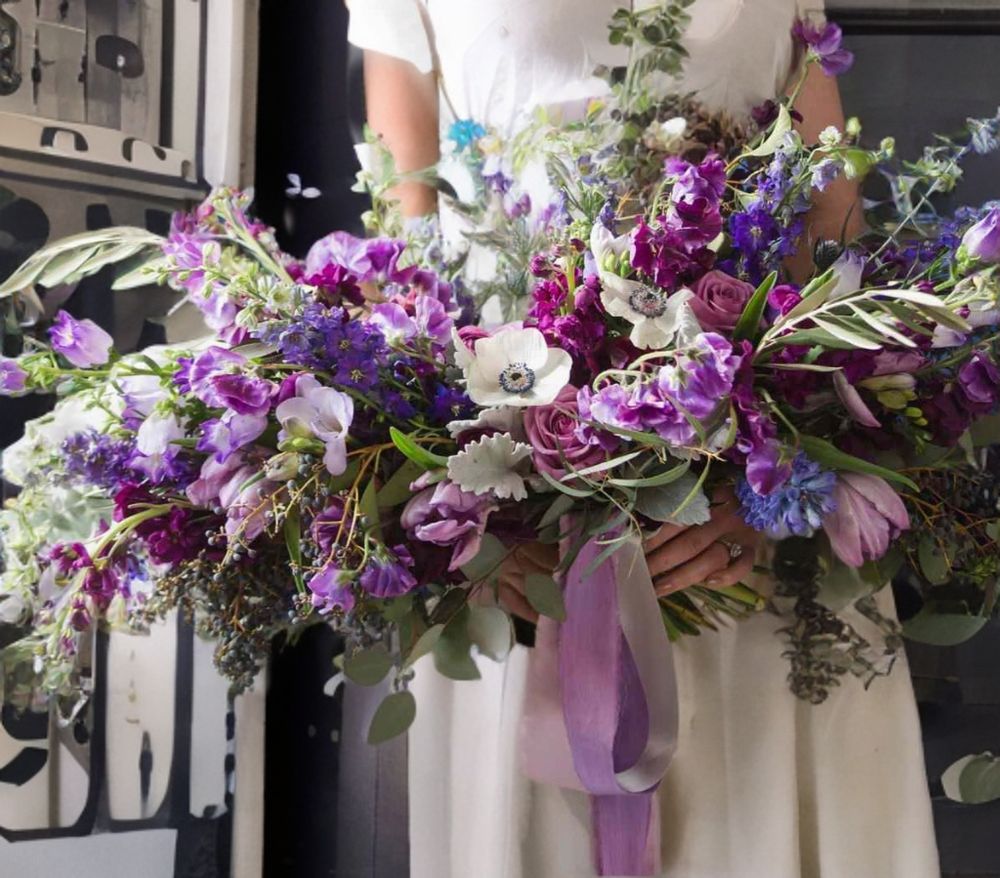Lovely wedding bouquet of purple and white mixed flowers 